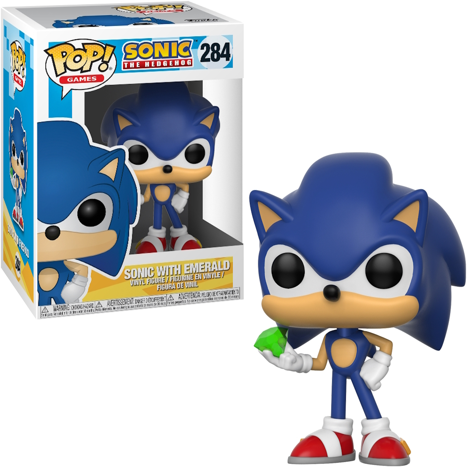 Niebieska figurka Sonica trzymająca szmaragd, z pudełkiem po lewej stronie. Czerwone buty.