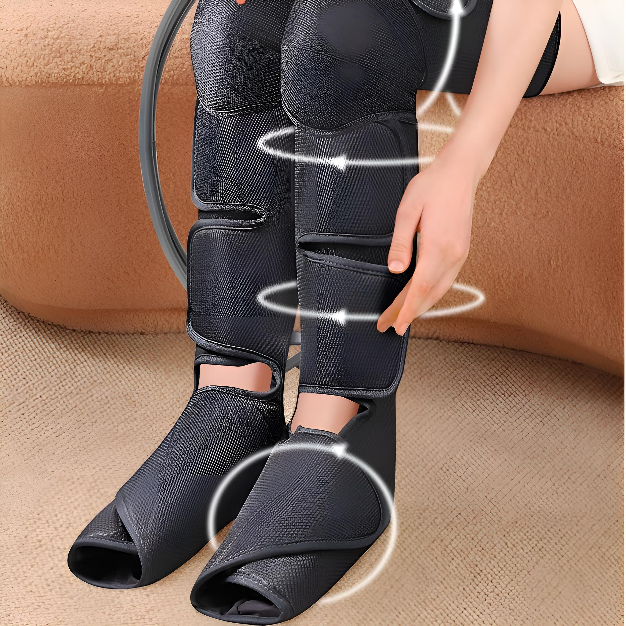 Beinmassagegerät in Gebrauch. Schwarze Wickel an den Beinen, weiße Kreise, die die Wirkung anzeigen. Hand justiert eine Wickel.
