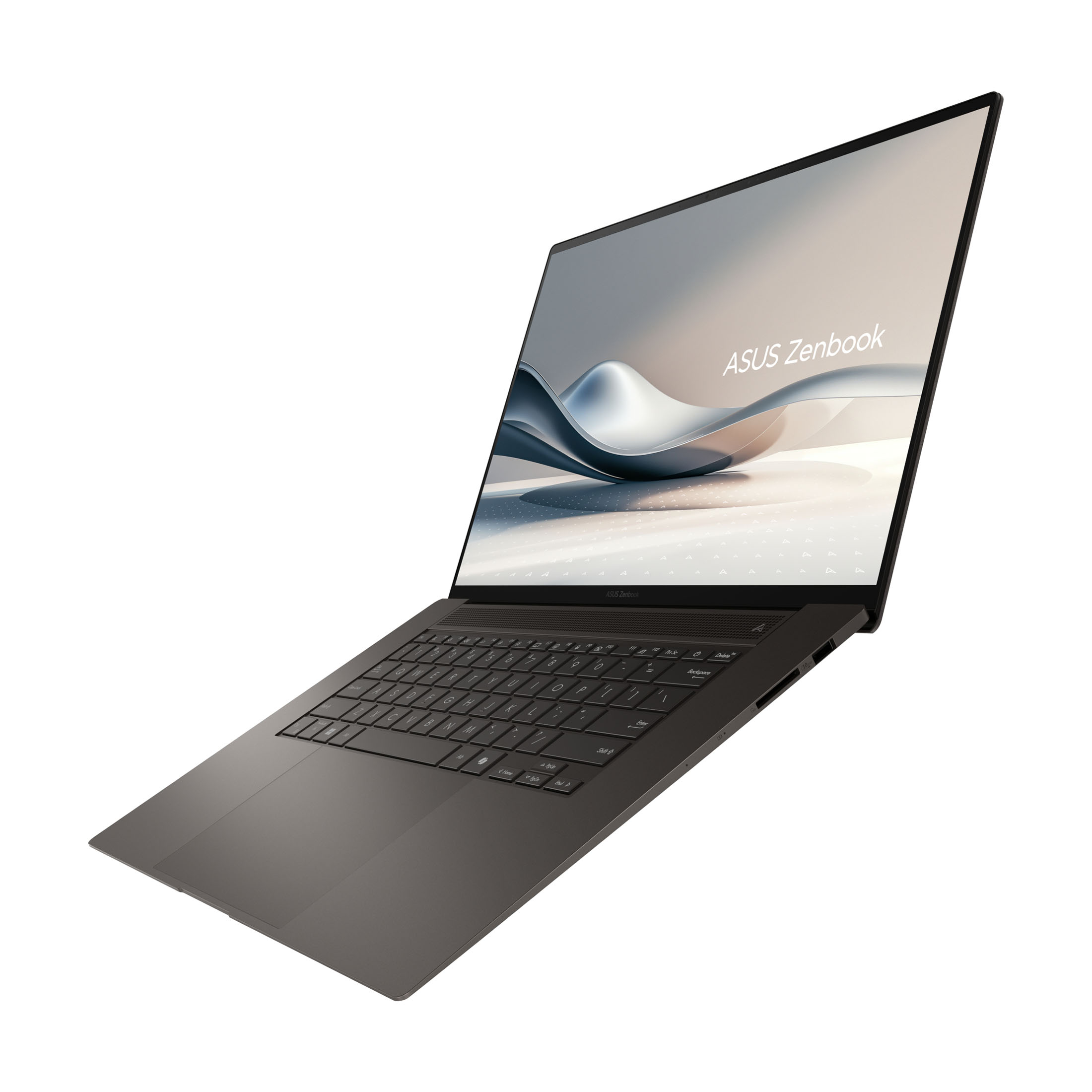 Asus Zenbook, diagonale Ansicht. Der Bildschirm zeigt ein wellenförmiges Design. Tastatur sichtbar. Dunkelgraue Farbe. Weißer Hintergrund.
