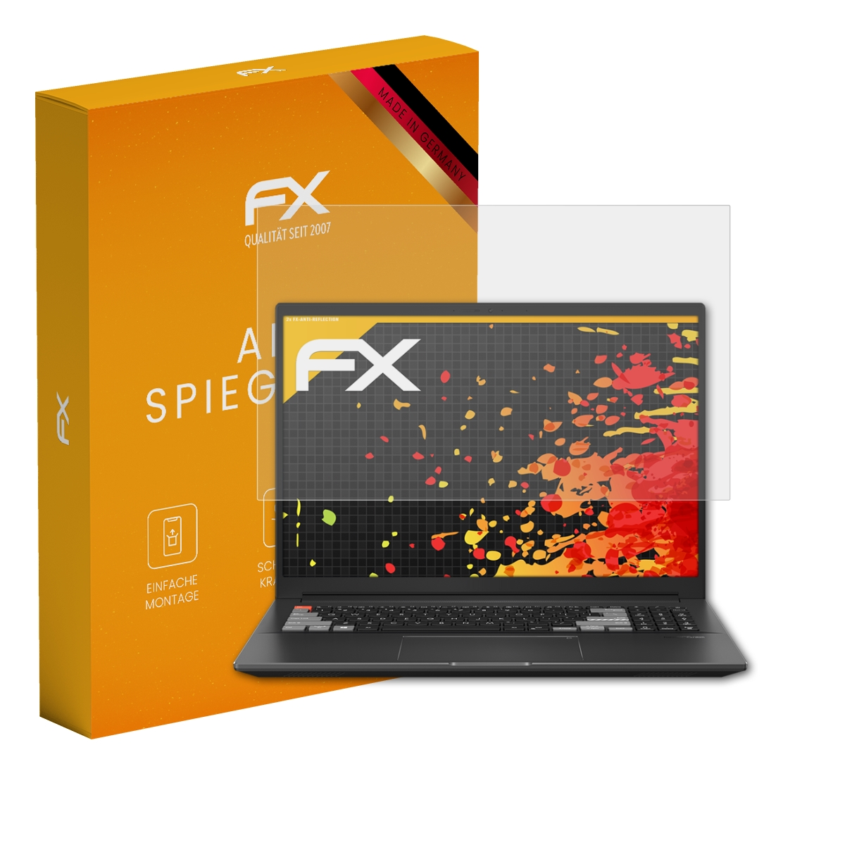 Eine orangefarbene FX-Box neben einem schwarzen Laptop mit einer auf dem Display angebrachten Displayschutzfolie.