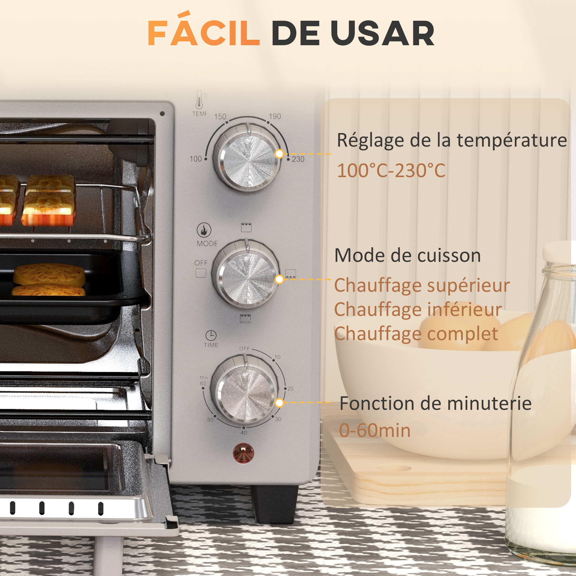 Un horno beige con accesorios como una rejilla, un recogedor de migas y pinzas.