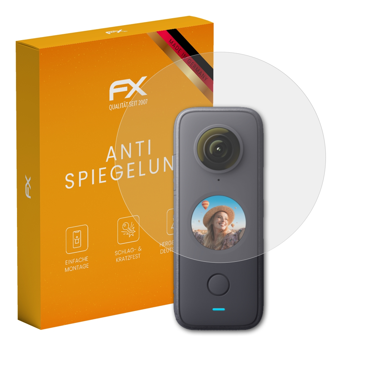 Kamera mit Displayschutz und oranger Box. Die Verpackung sagt 'FX', 'ANTI SPIEGELUNG'.