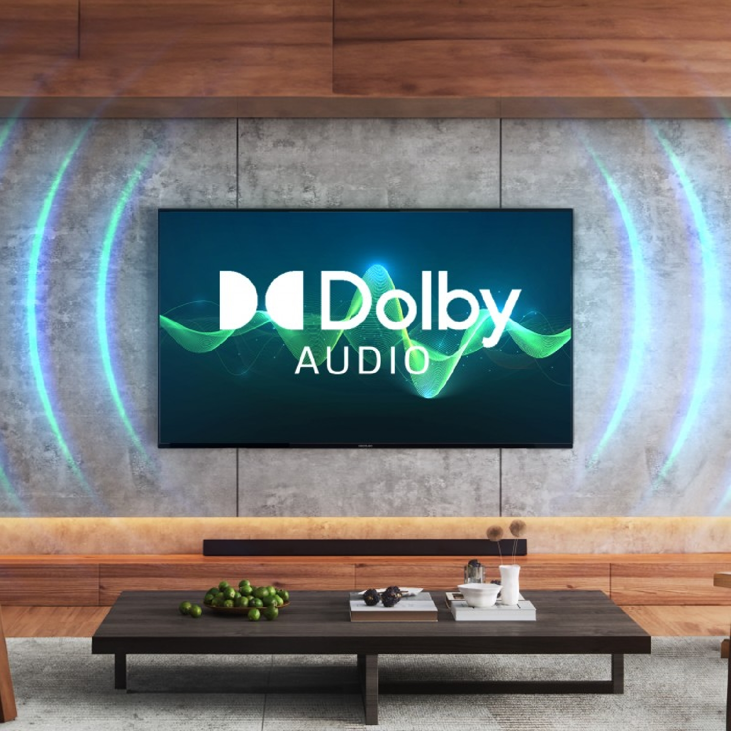 Un televisore con logo audio Dolby. Sotto un tavolo e alcuni elementi decorativi.