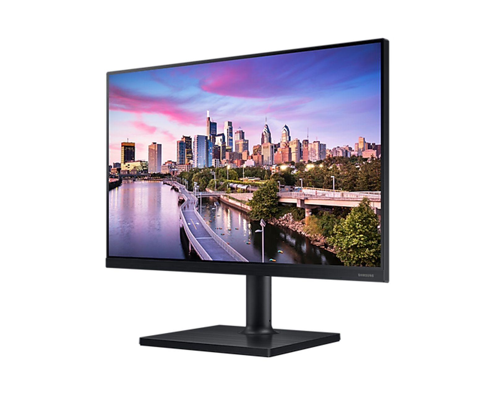 Monitor per computer nero che mostra una scena cittadina con un fiume e un ponte. Il cielo è colorato.