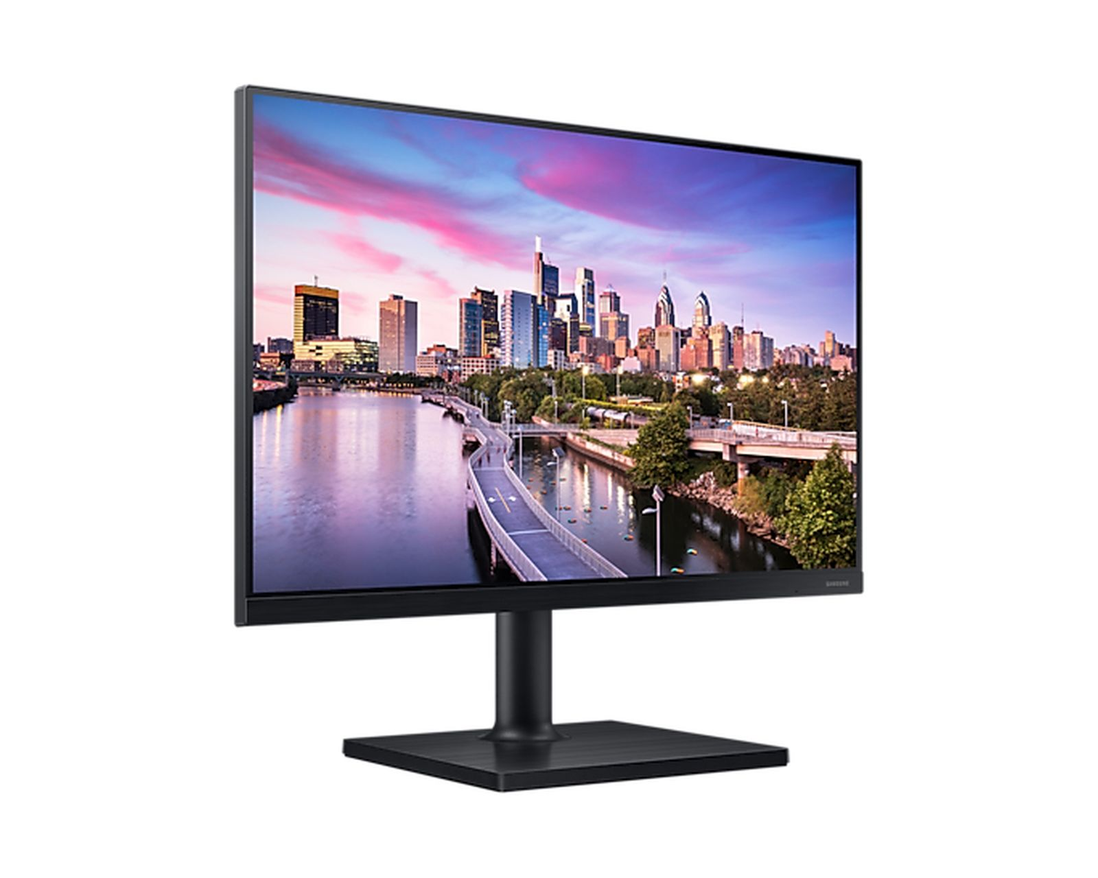 Monitor per computer nero che mostra una scena cittadina con un fiume e un ponte. Il cielo è colorato.