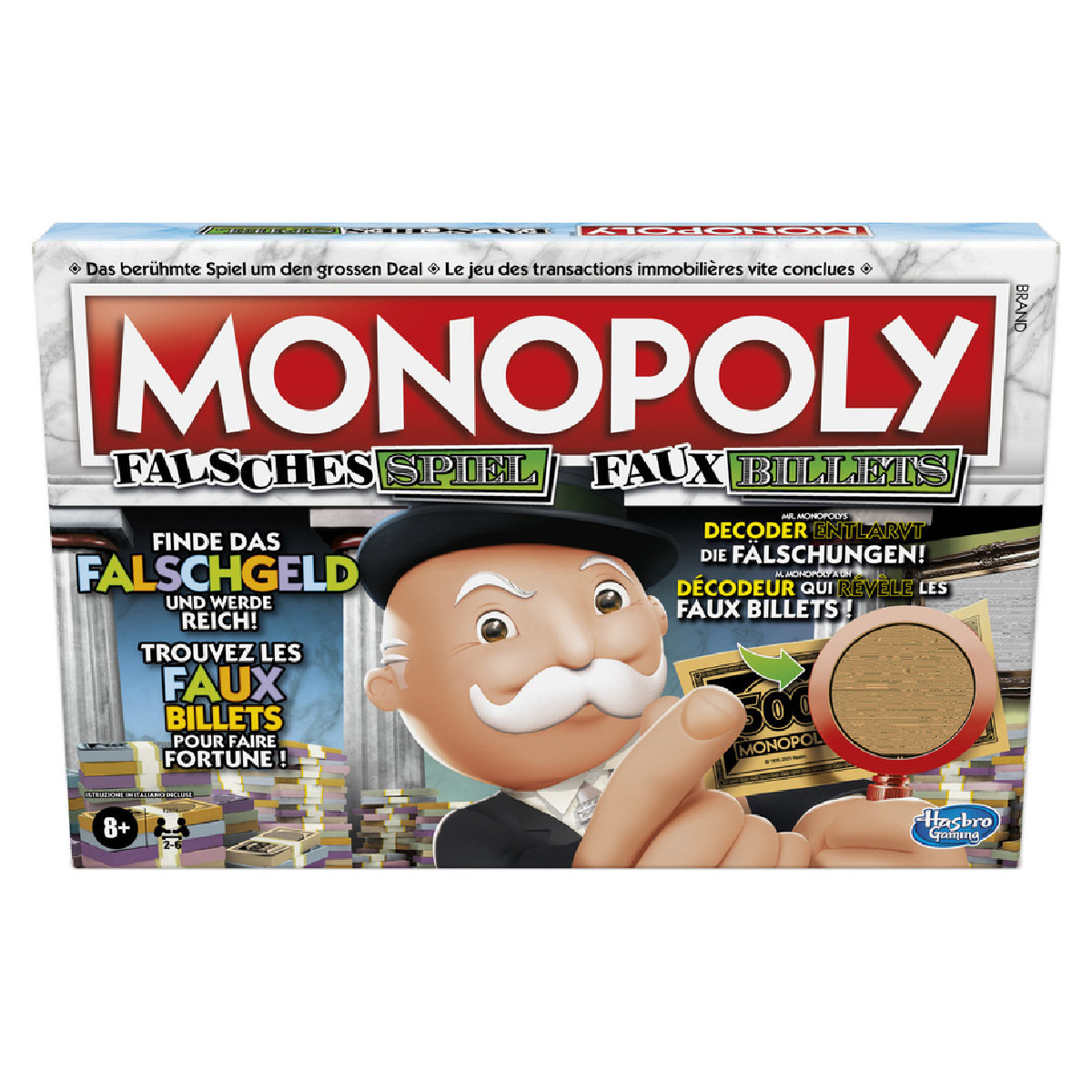 Monopoly-Spielschachtel zeigt Mann mit Schnurrbart, der auf gefälschten 500-Dollar-Schein zeigt, Text in mehreren Sprachen.