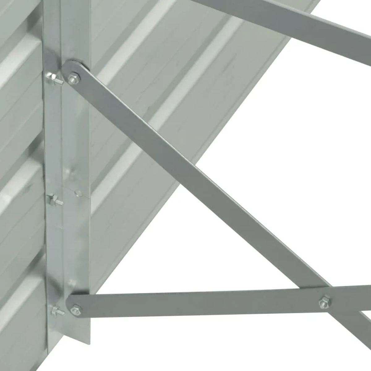 Nahaufnahme einer Metallstruktur mit Bolzen. Silbermetall mit Grauton.