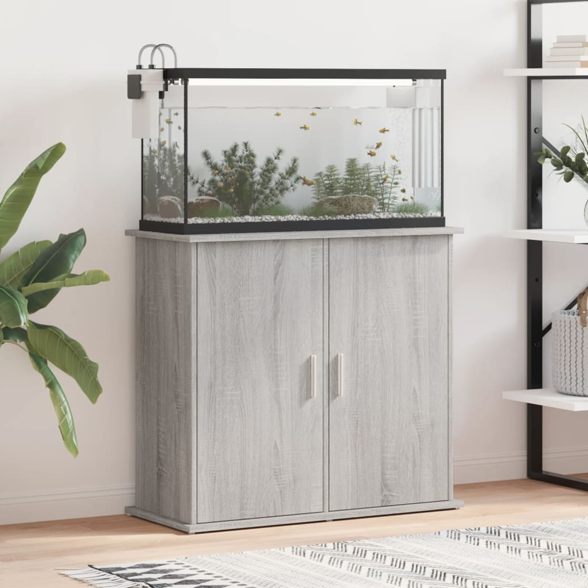 Schrank mit Aquarium oben, Fische sichtbar, graues Holz, modernes Design.