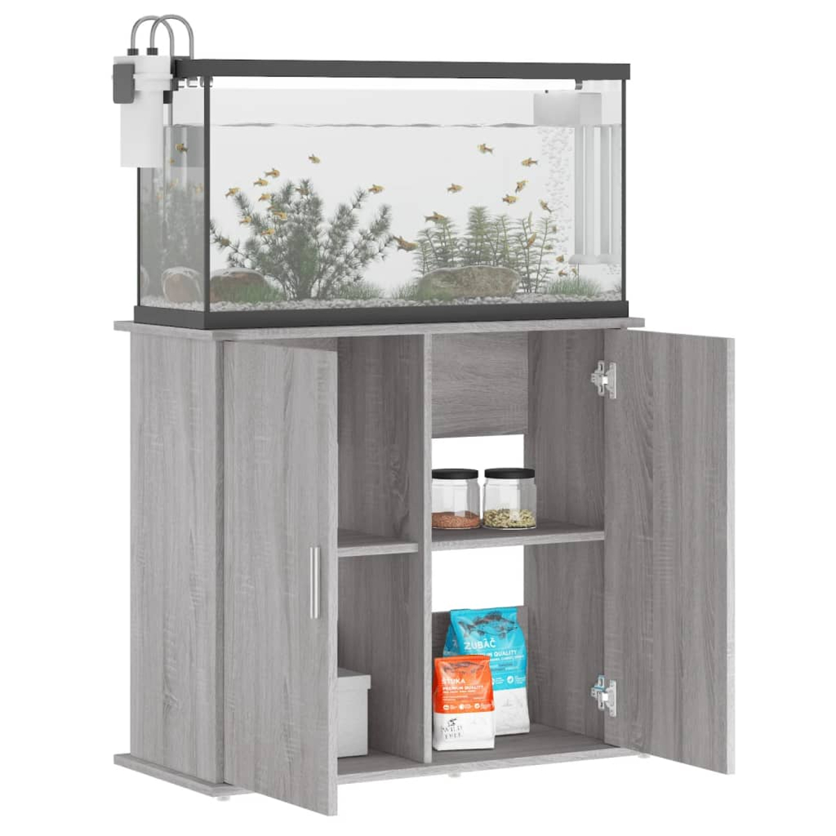 Aquarium auf einem grauen Schrank. Das Becken hat Fische, Pflanzen und einen Filter. Schranktüren offen.