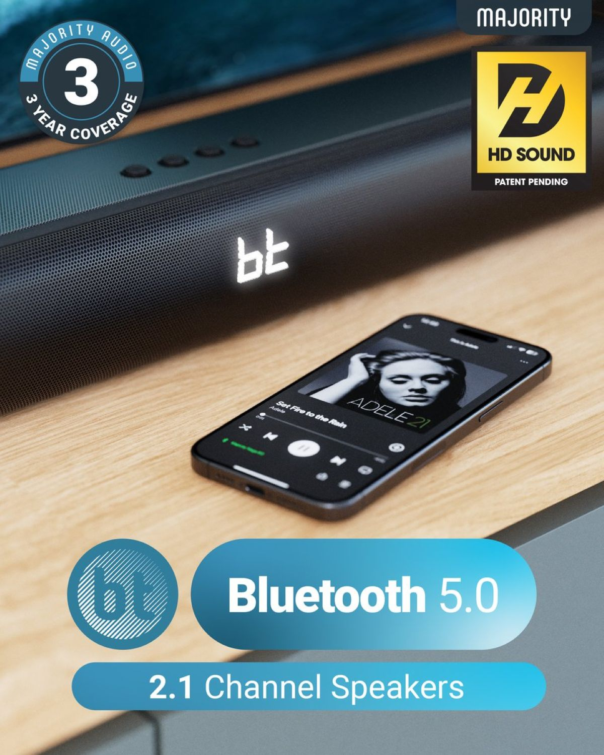 Soundbar with a phone playing music. Bluetooth 5.0 and 2.1 channel speakers information.