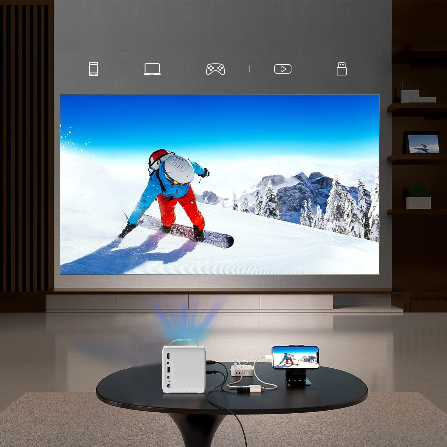 Un proiettore proietta uno snowboarder su una scena di montagna innevata. Sotto un tavolo.