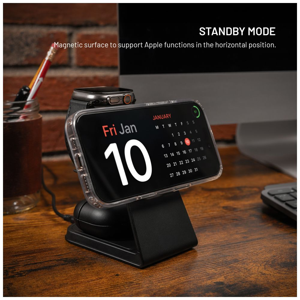 Schwarze Ladestation mit Telefon und Uhr. Schreibtisch mit Stift, Glas und Tastatur.