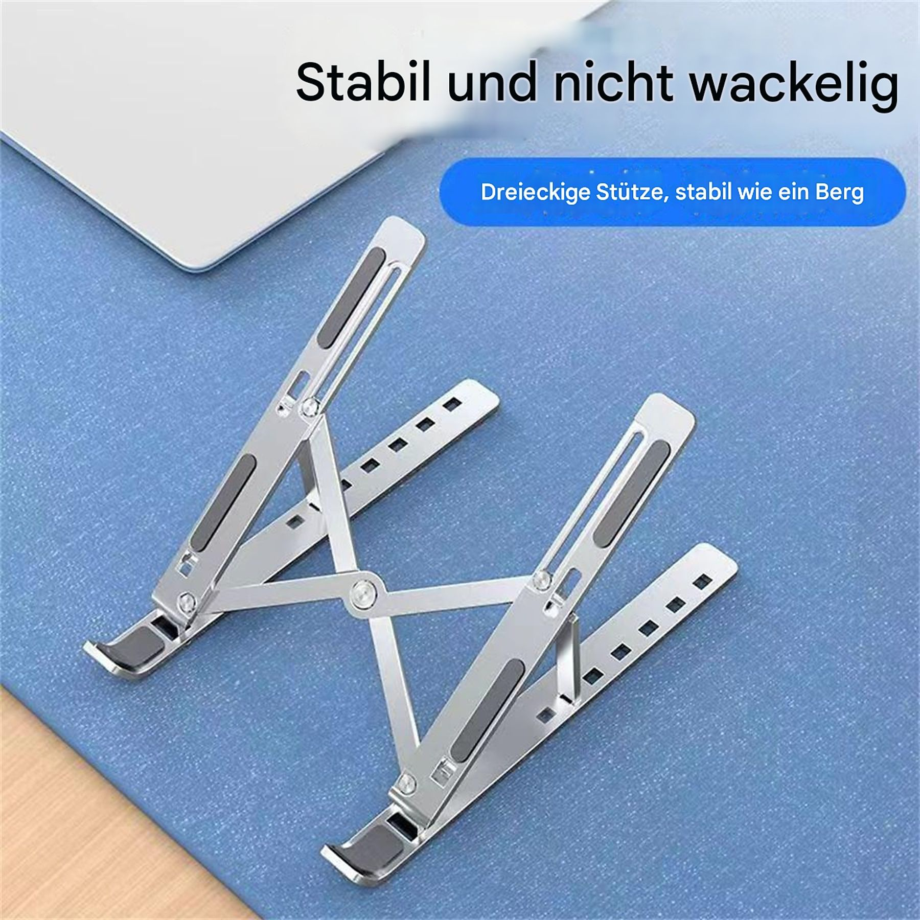 Laptopständer, silber, auf blauer Oberfläche. Hintergrund: blau. Vordergrund: Ständer.