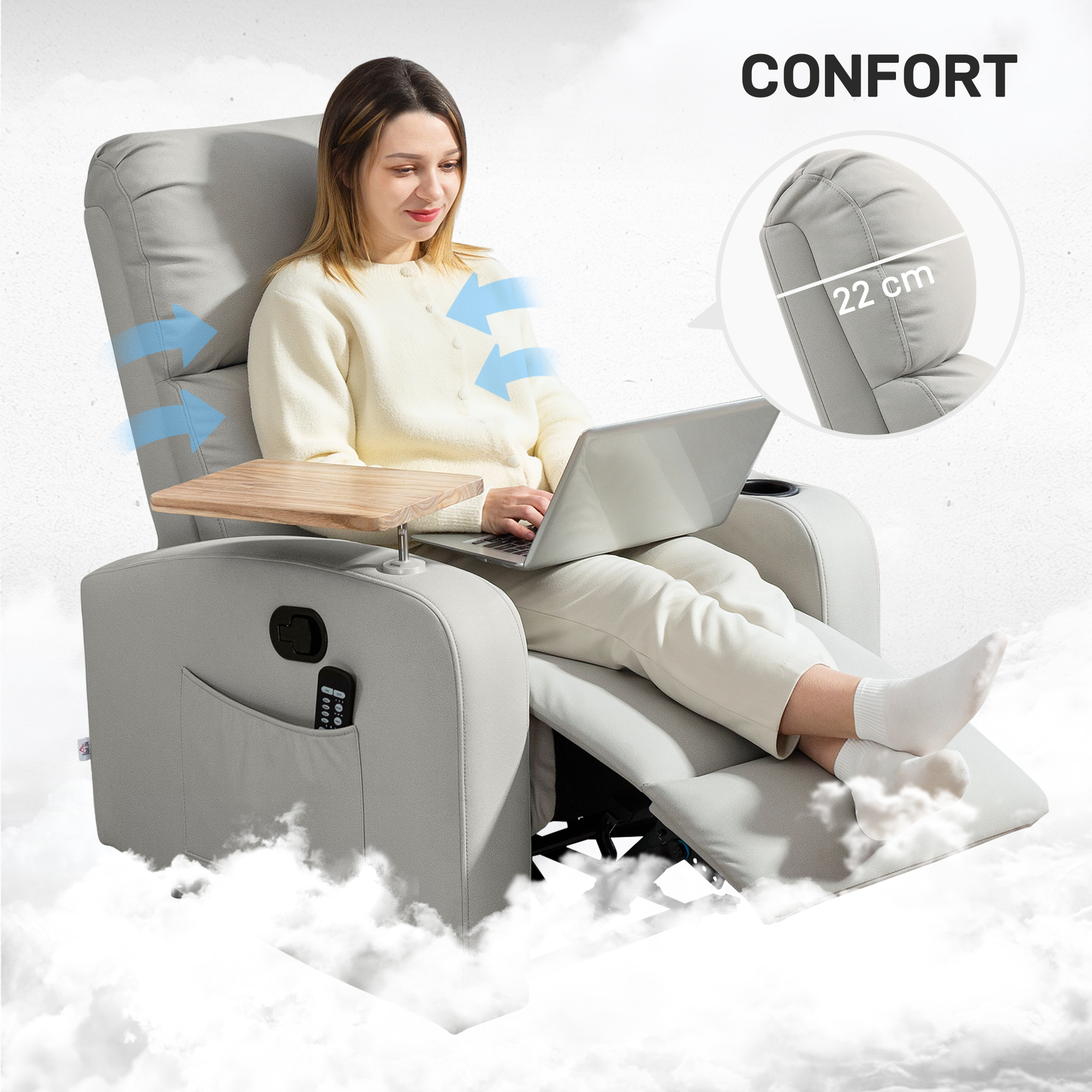 Mujer sentada en un sillón reclinable gris usando una computadora portátil, con una bandeja y un mando.