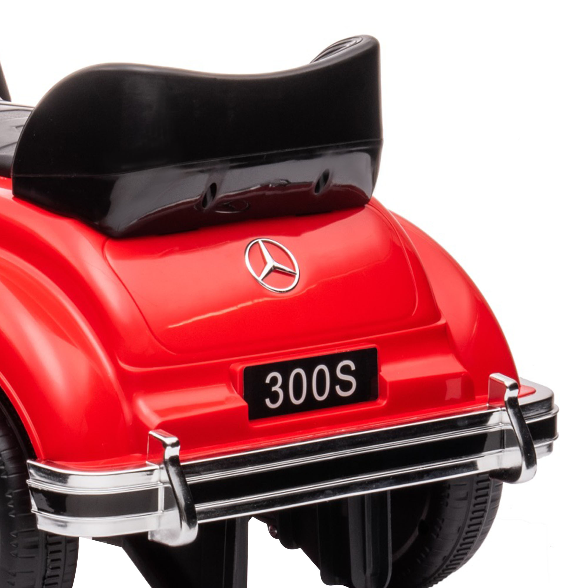 Parte trasera de un coche de juguete rojo con alerón negro, logo de Mercedes-Benz y matrícula '300S'.
