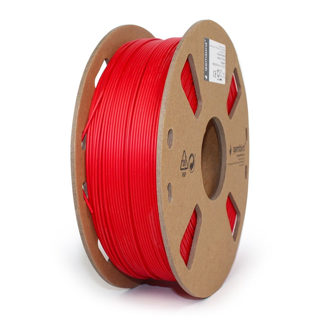 Un carrete de filamento rojo para impresión 3D, sobre un fondo blanco.
