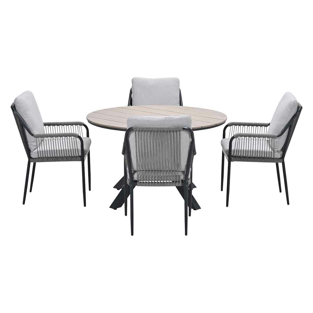A round outdoor table with four chairs. Chairs have gray cushions and rope backs. The table has a wooden top.