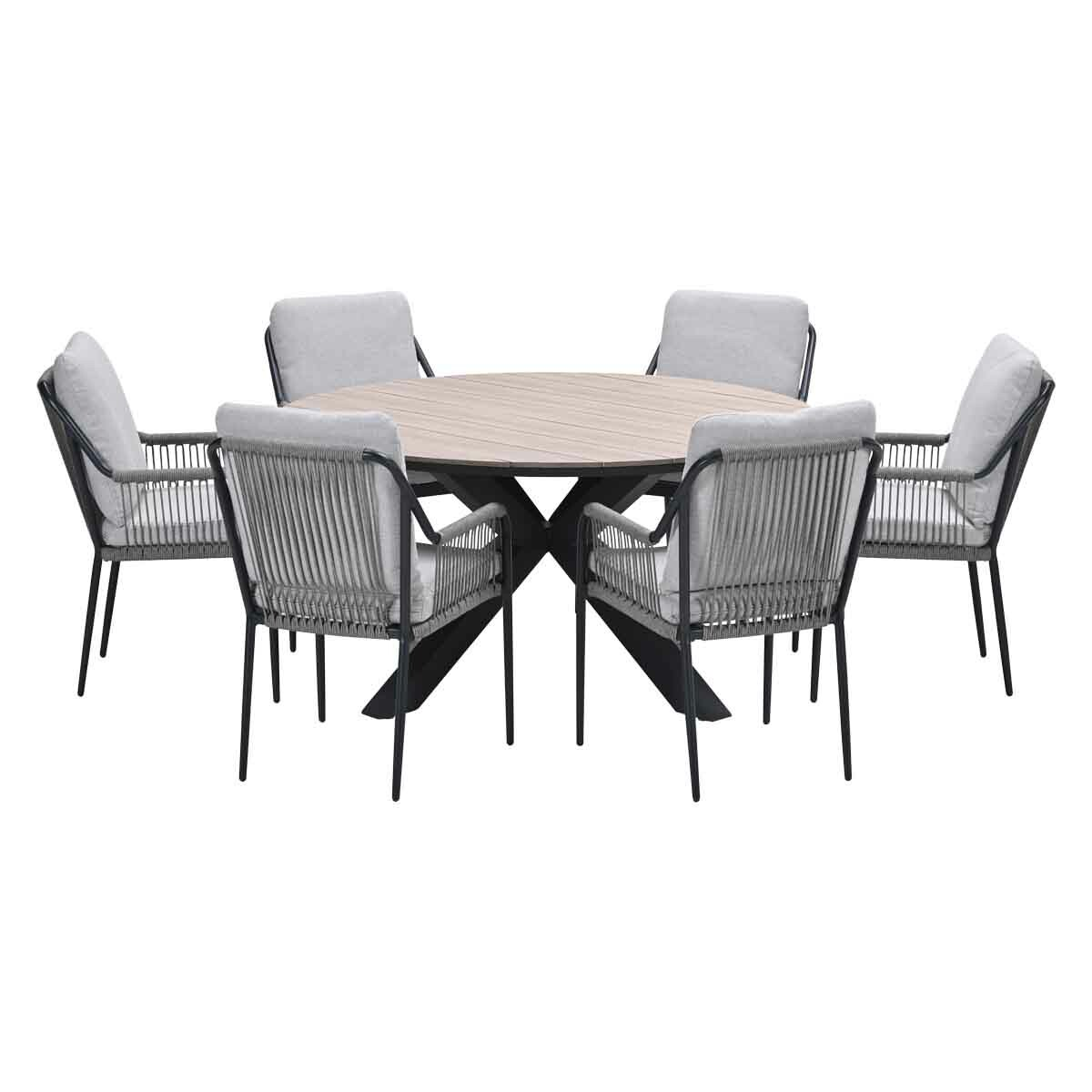 Round wooden table with six chairs. Chairs have gray cushions and black frames. Table has black legs.