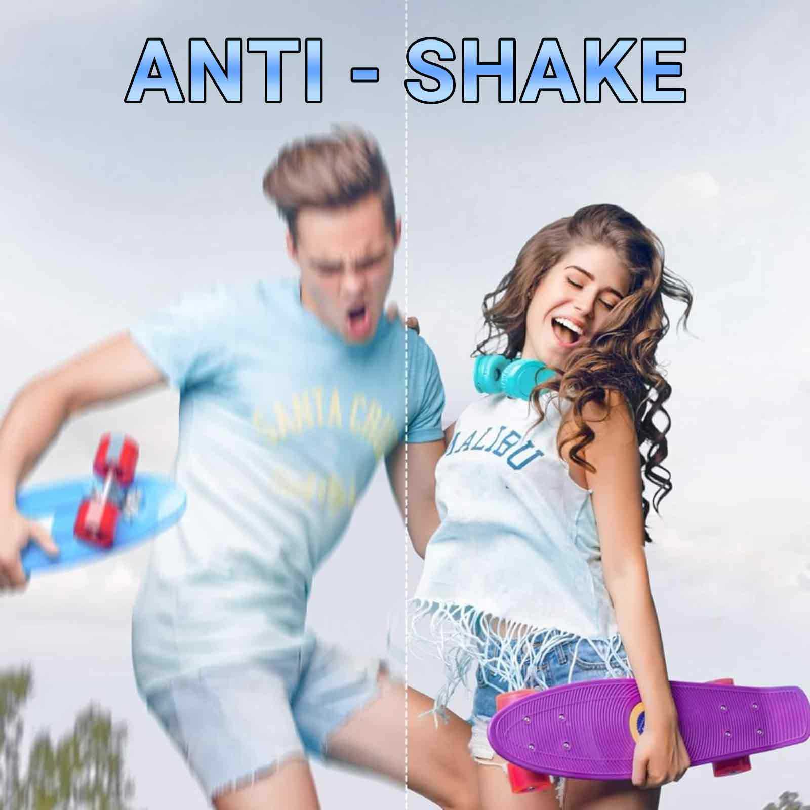 Ein Mann und eine Frau mit Skateboards. Der Mann sieht schockiert aus, die Frau lacht. Text sagt "ANTI-SHAKE".