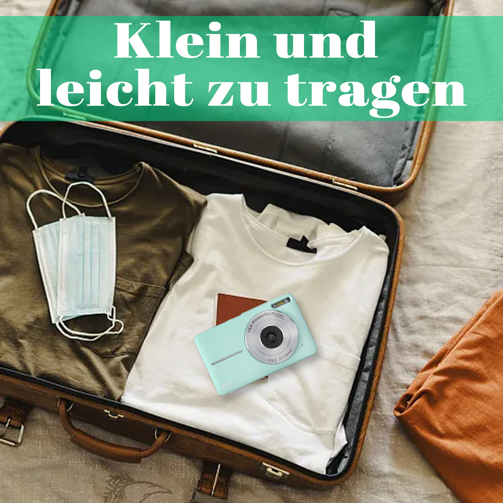 Offener Koffer mit Kleidung, Kamera und Masken. Text: Klein und leicht zu tragen.