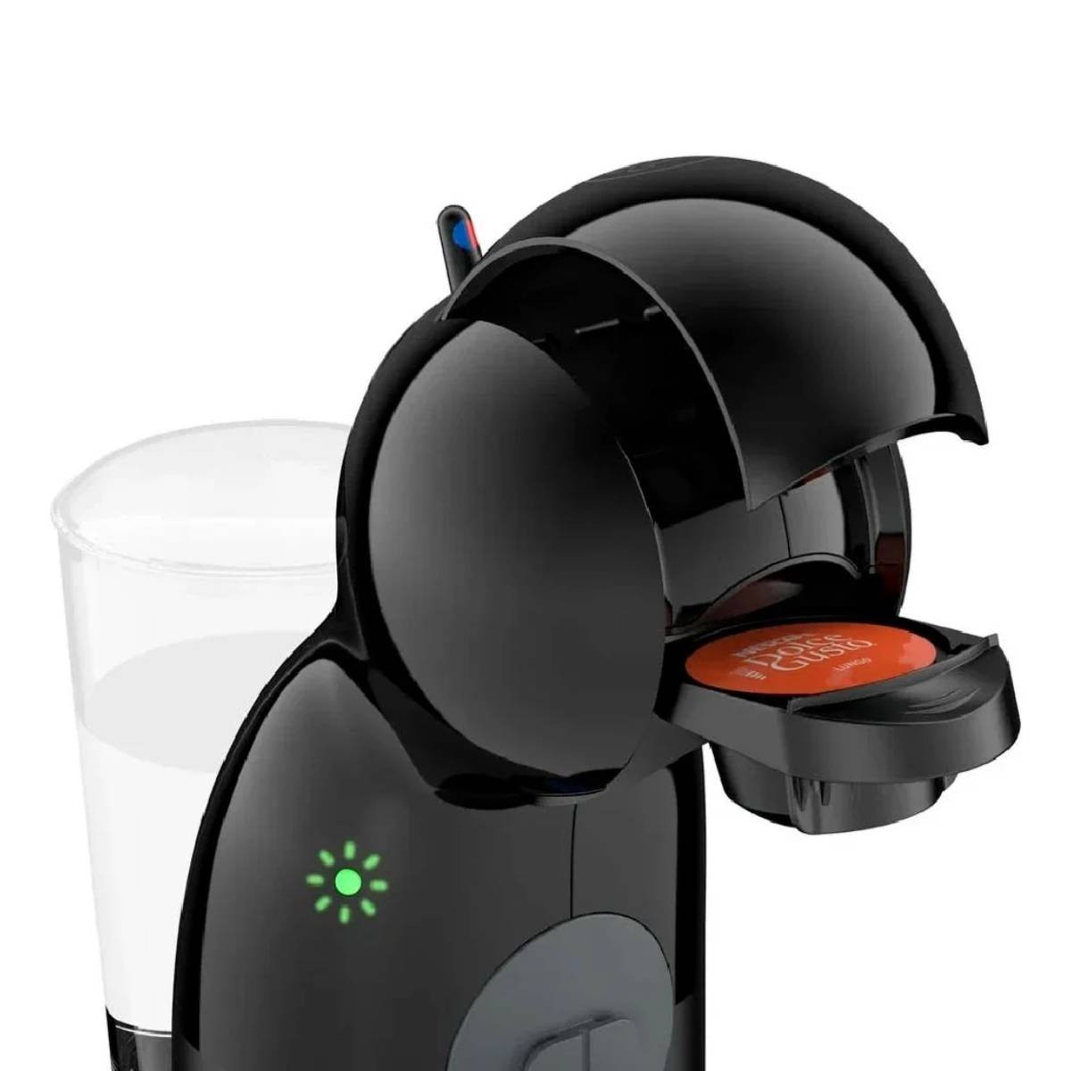 Macchina da caffè nera con un bicchiere d'acqua, una cialda di caffè è visibile. Luce verde accesa. La macchina è aperta.