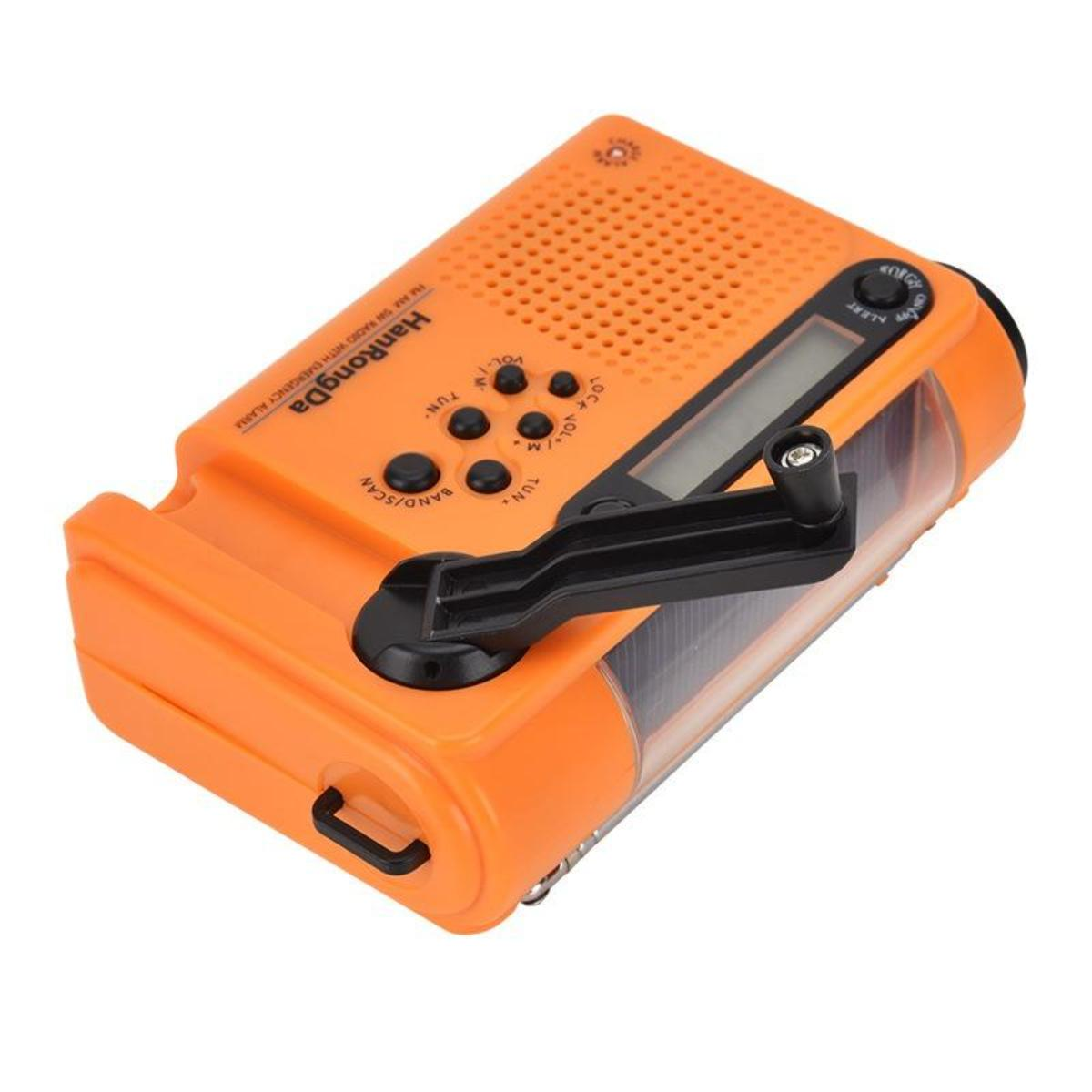 Oranges Kurbelradio mit Knöpfen, einem Bildschirm und einer Kurbel. Text auf dem Radio lautet 'HanRongDa' und 'FM AM SW RADIO WITH EMERGENCY ALARM'.