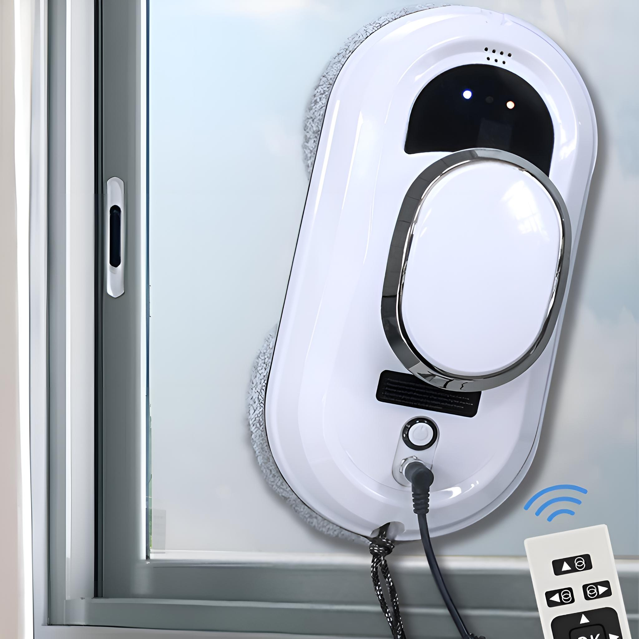 Weißer Fensterputzroboter auf Glas. Fernbedienung mit OK-Taste. Fensterrahmen links.