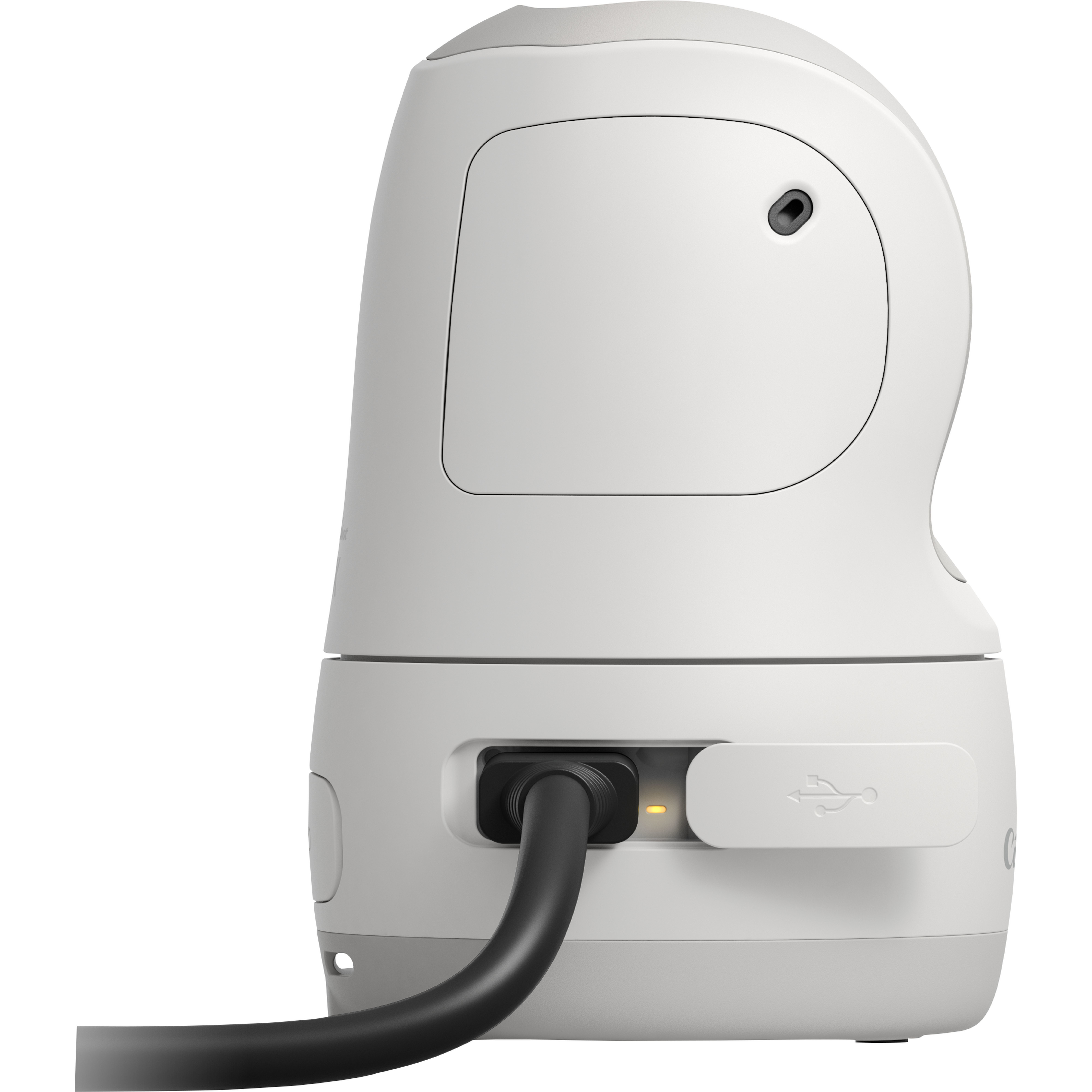 Dispositivo blanco con cable negro enchufado. Tiene un puerto USB y un agujero pequeño. El fondo es blanco.
