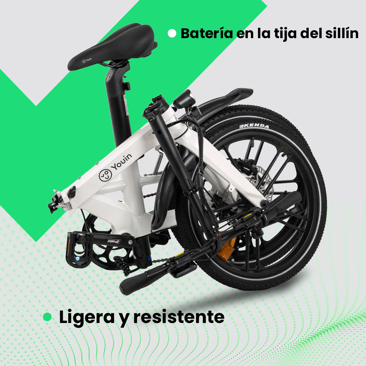 Una bicicleta plegable blanca y negra se muestra sobre un fondo verde. Tiene neumáticos negros y un asiento negro.