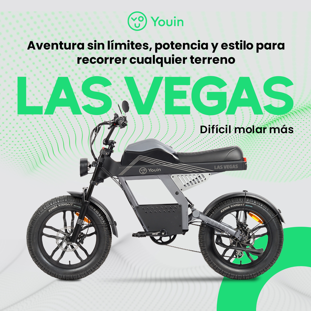 Una bicicleta eléctrica Youin. El texto dice: Aventura sin límites. Es un modelo Las Vegas, negro y gris.