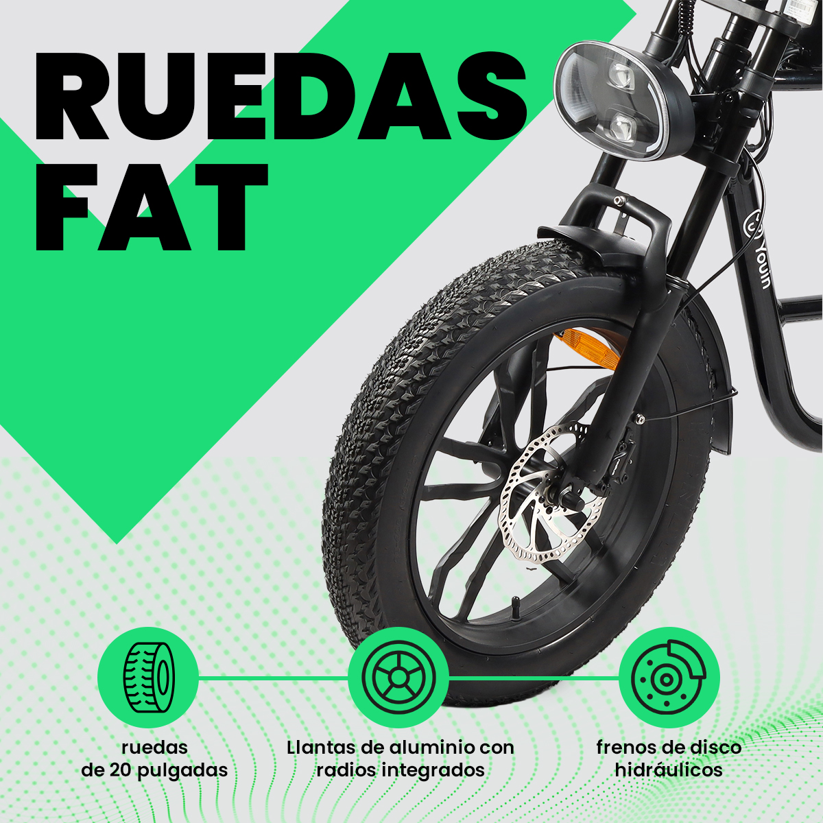 Bicicleta negra de llanta ancha con texto: RUEDAS FAT. Detalles: ruedas de 20 pulgadas, llantas de aluminio, frenos de disco hidráulicos.