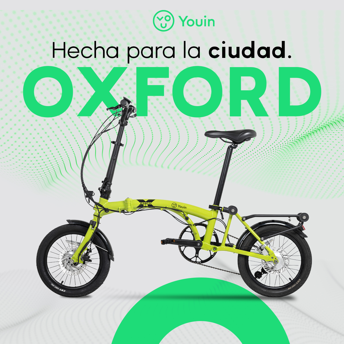 Bicicleta plegable Oxford verde lima. Texto dice 'Hecha para la ciudad'. Gráfico verde. Fondo blanco.