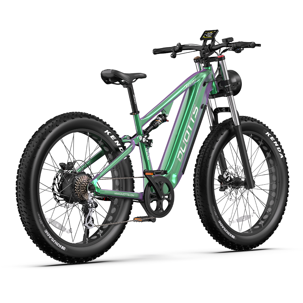 Bicicleta eléctrica verde y morada con neumáticos gruesos, asiento y manillar negros, sobre fondo blanco.