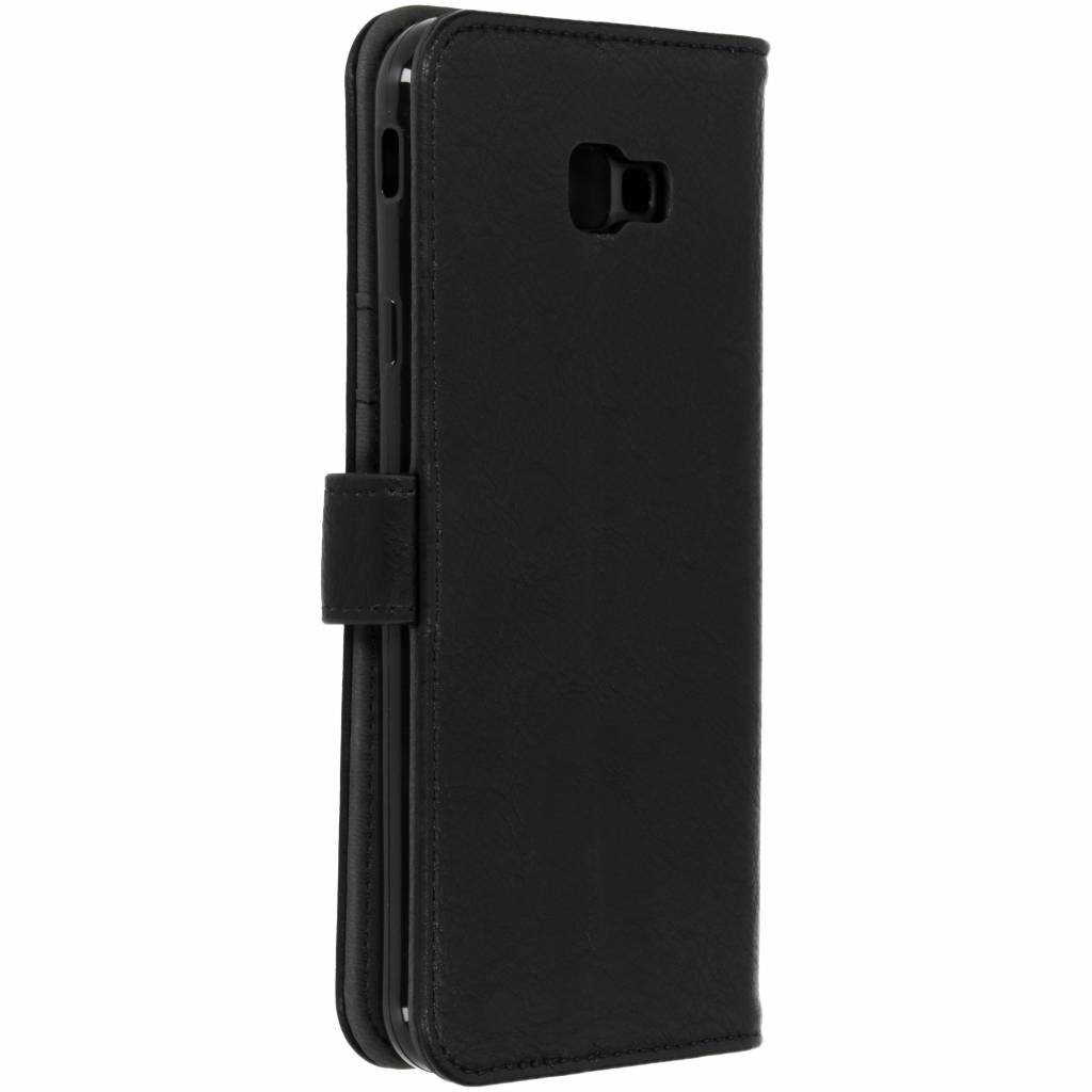 Étui de téléphone en cuir noir, fermé, vue latérale. Fermeture à rabat.