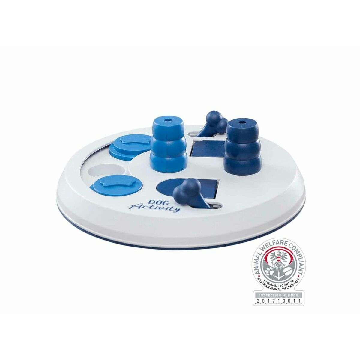 Juguete rompecabezas para perros. Base blanca con elementos azules: torres, tapas y deslizadores. Etiqueta de bienestar animal en el fondo.