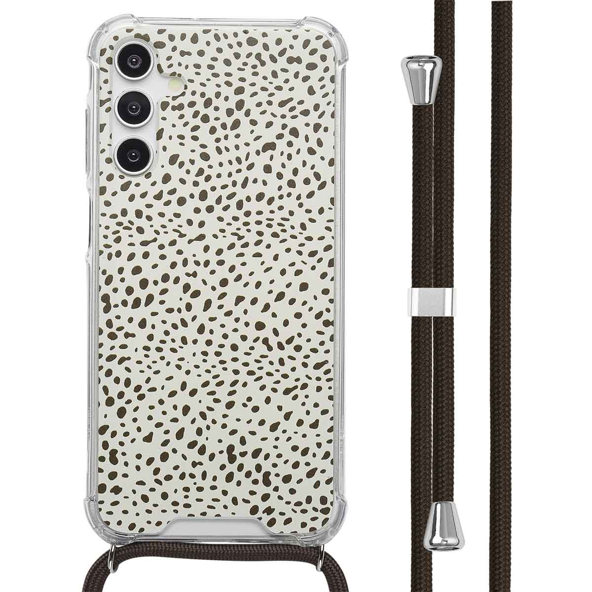 Een telefoon met een hoesje met een witte achtergrond met bruine stippen, met een bruin koord.
