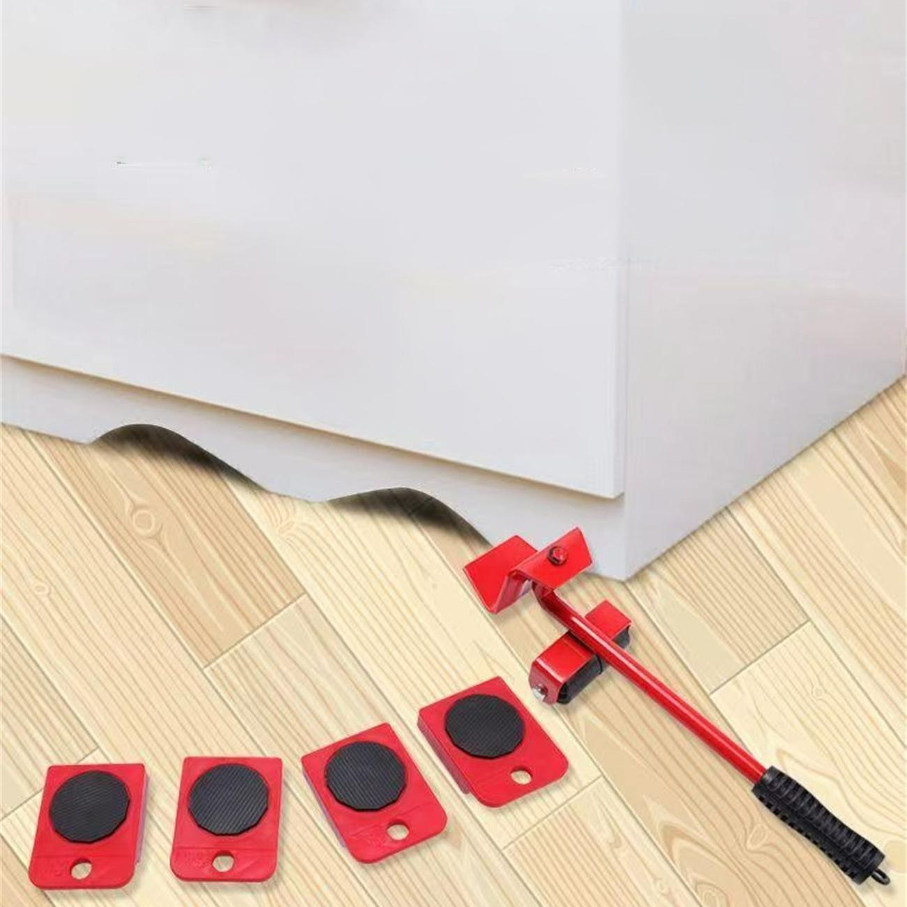 Ein weißer Schrank wird mit roten Möbelrollern auf einem Holzboden bewegt.