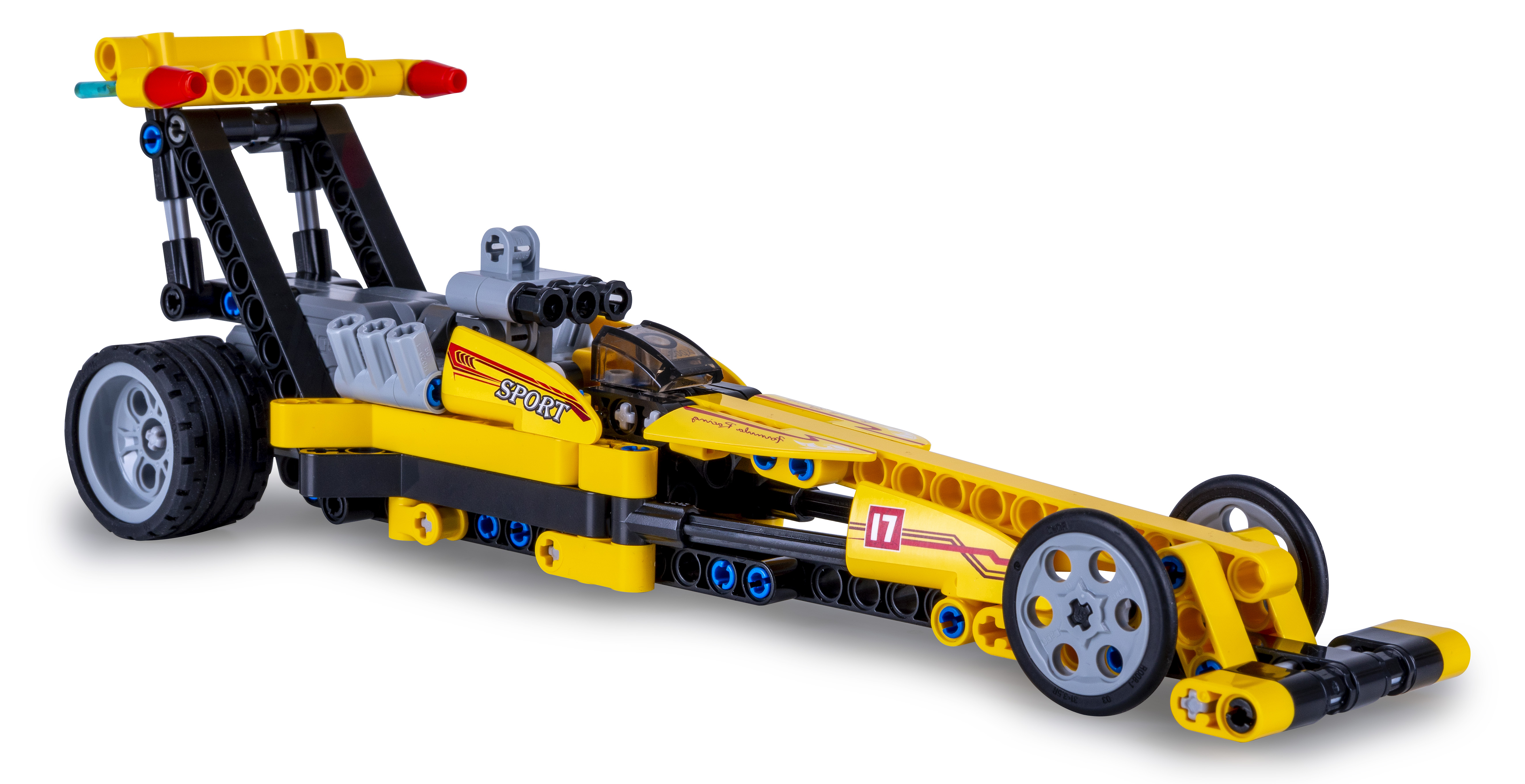 Ein gelbes Spielzeug-Rennauto aus Plastikbausteinen, mit klarer Windschutzscheibe und schwarzen Akzenten.