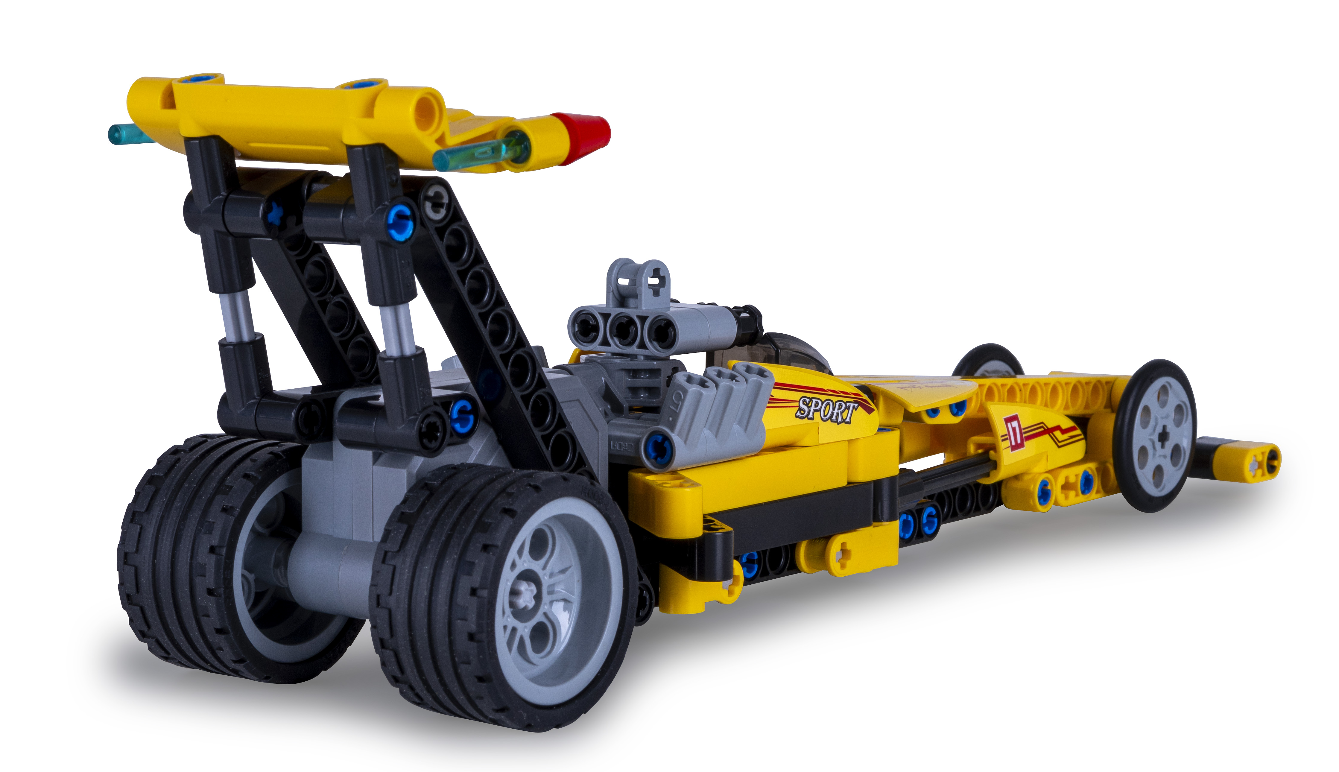 Gelbes und schwarzes Spielzeug-Dragster-Auto mit großen Hinterrädern.