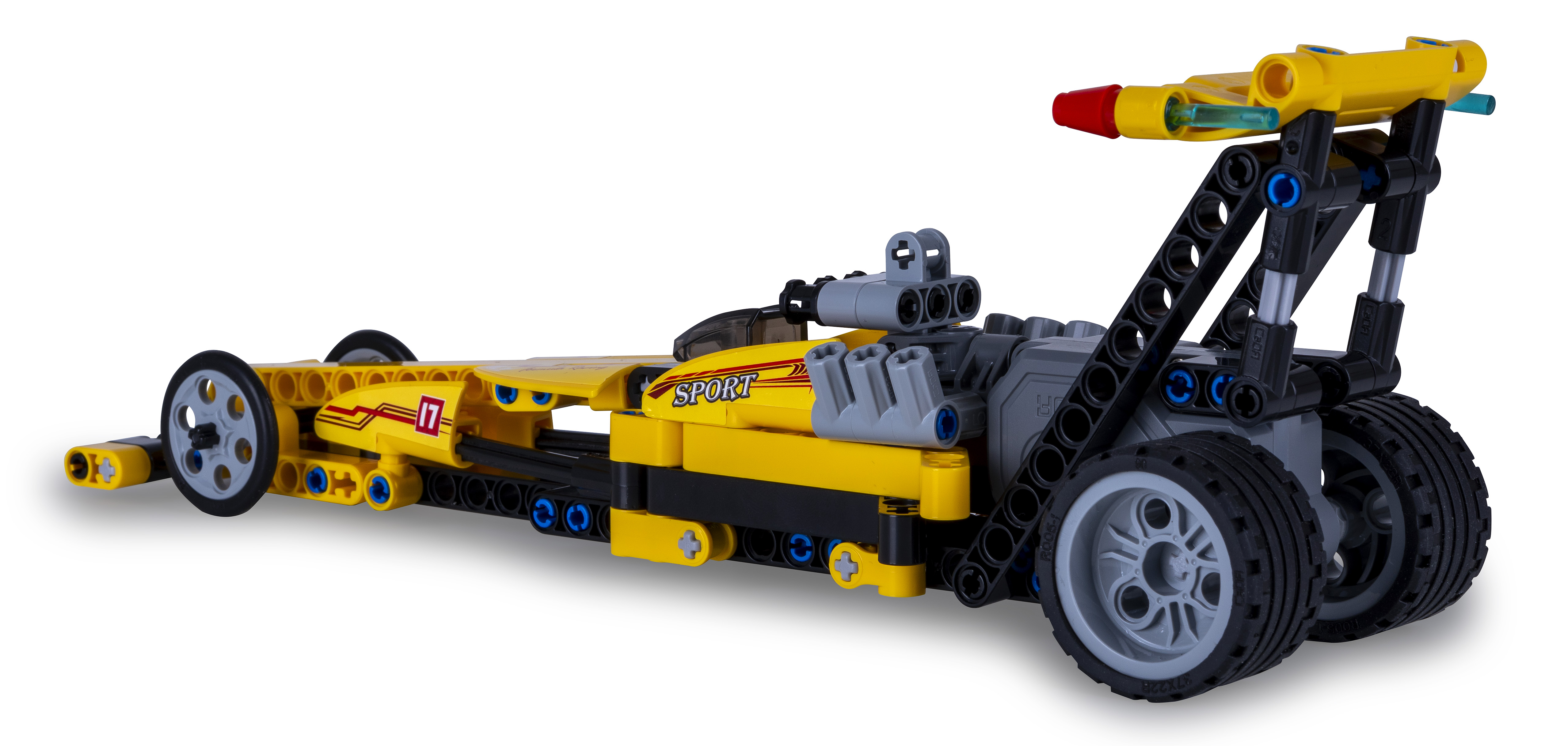 Ein gelbes Spielzeug-Rennauto aus Plastikbausteinen, mit klarer Windschutzscheibe und schwarzen Akzenten.
