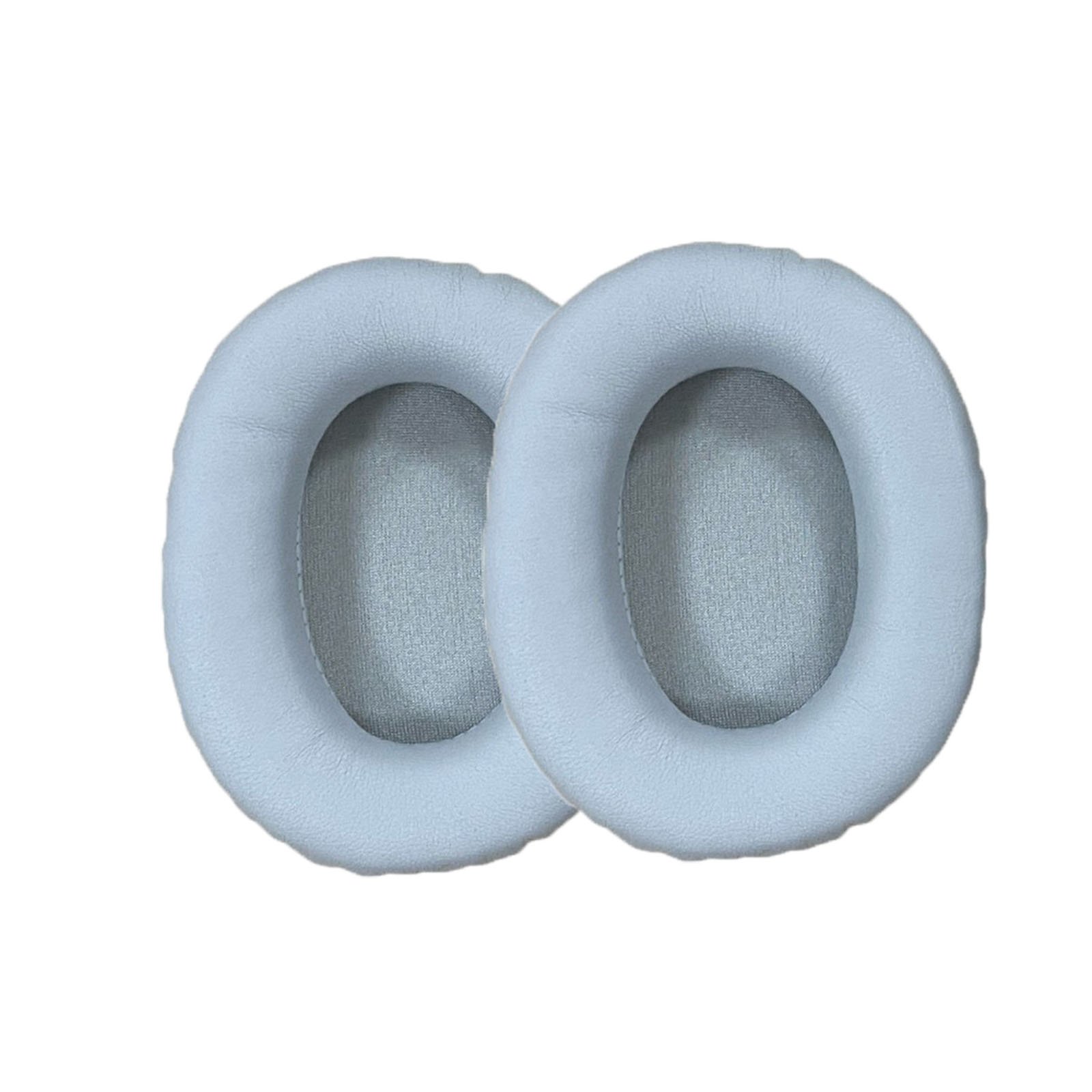 Due cuscinetti auricolari ovali azzurri. Sono uno accanto all'altro.