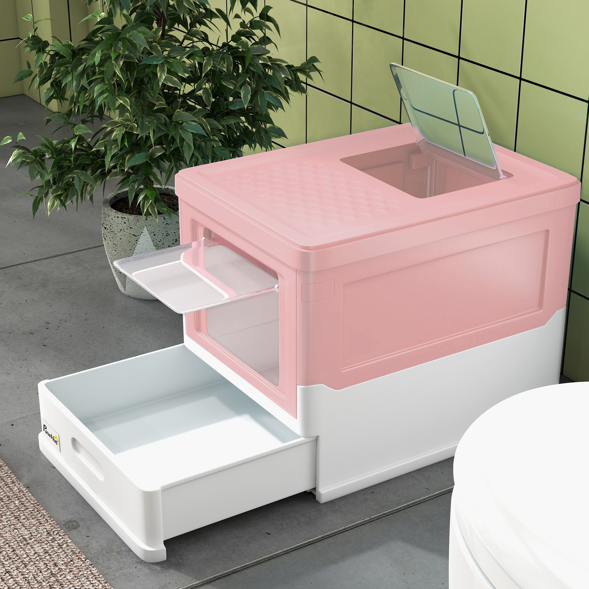 Una caja de arena para gatos rosa y blanca con un cajón y una parte superior abierta, en un baño.