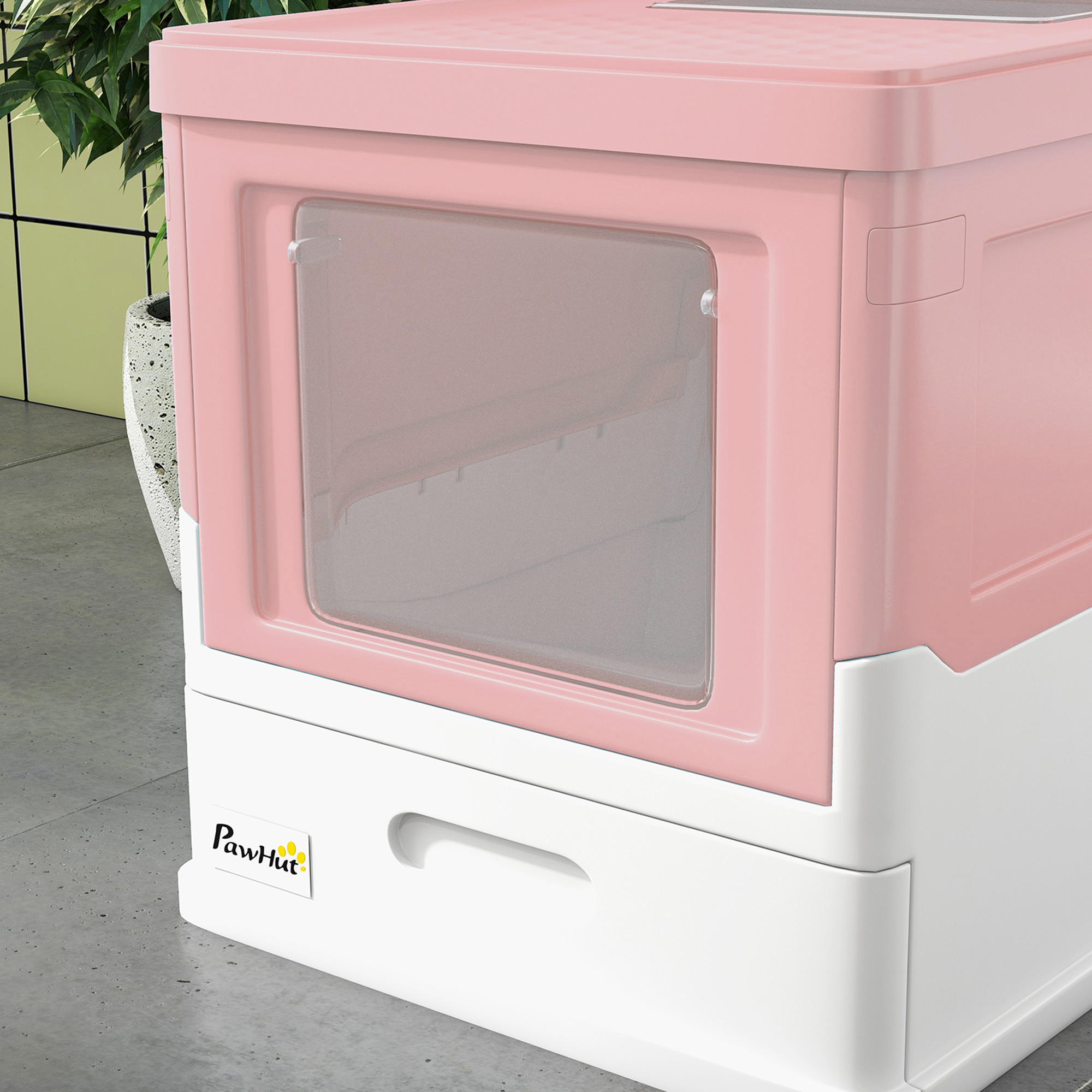 Primo piano della lettiera rosa e bianca che mostra l'apertura. C'è una maniglia in basso.