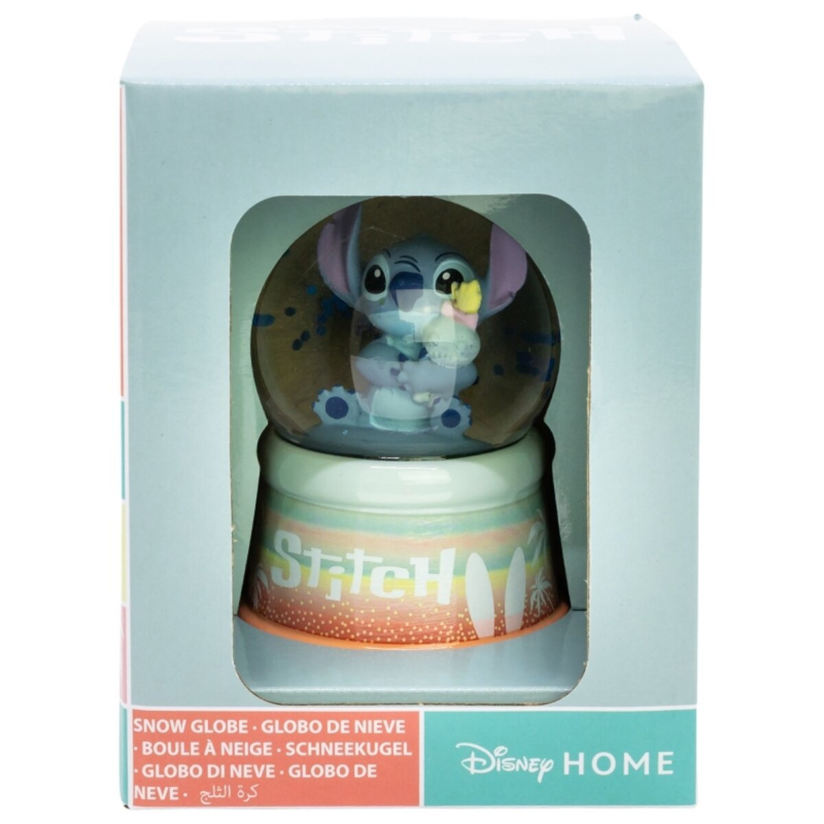 Globo de nieve con Stitch, en una caja con texto en varios idiomas.