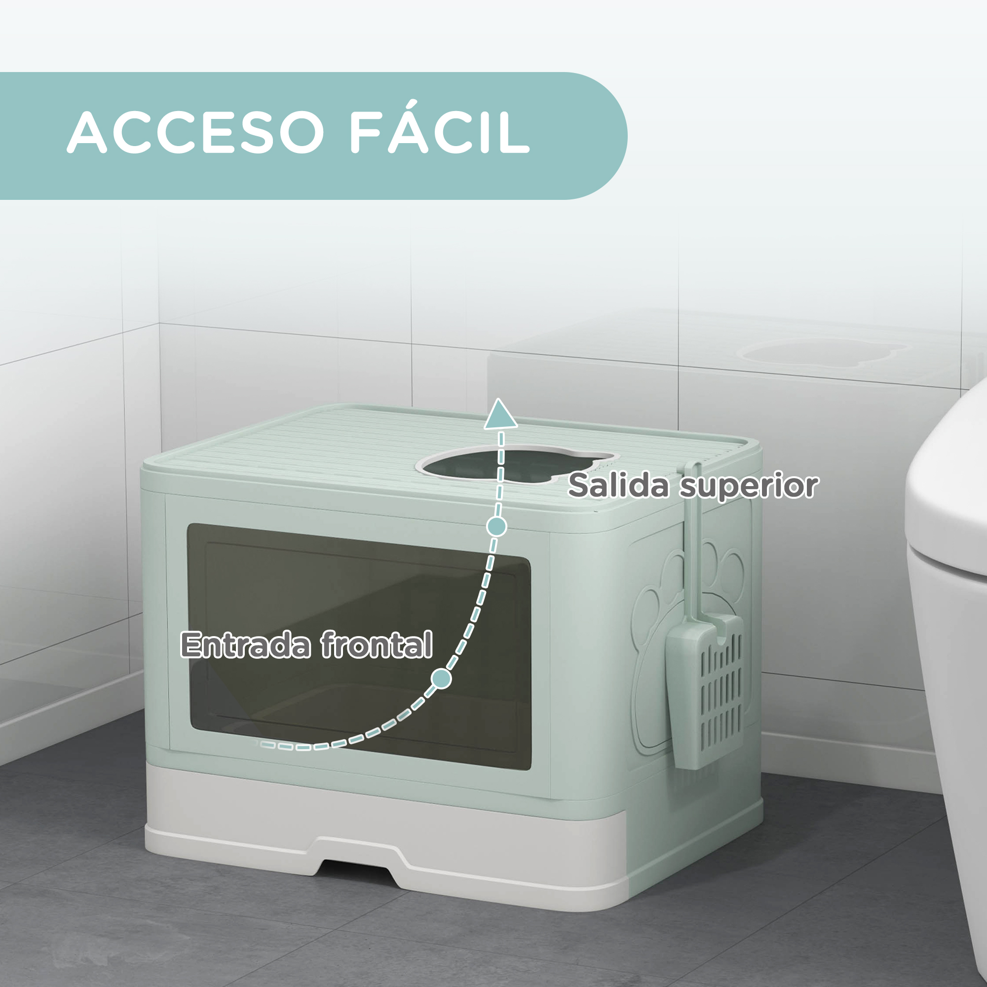 Una caja de arena verde con entrada superior y frontal en un baño. La caja tiene un soporte para pala. Texto: ACCESO FÁCIL.