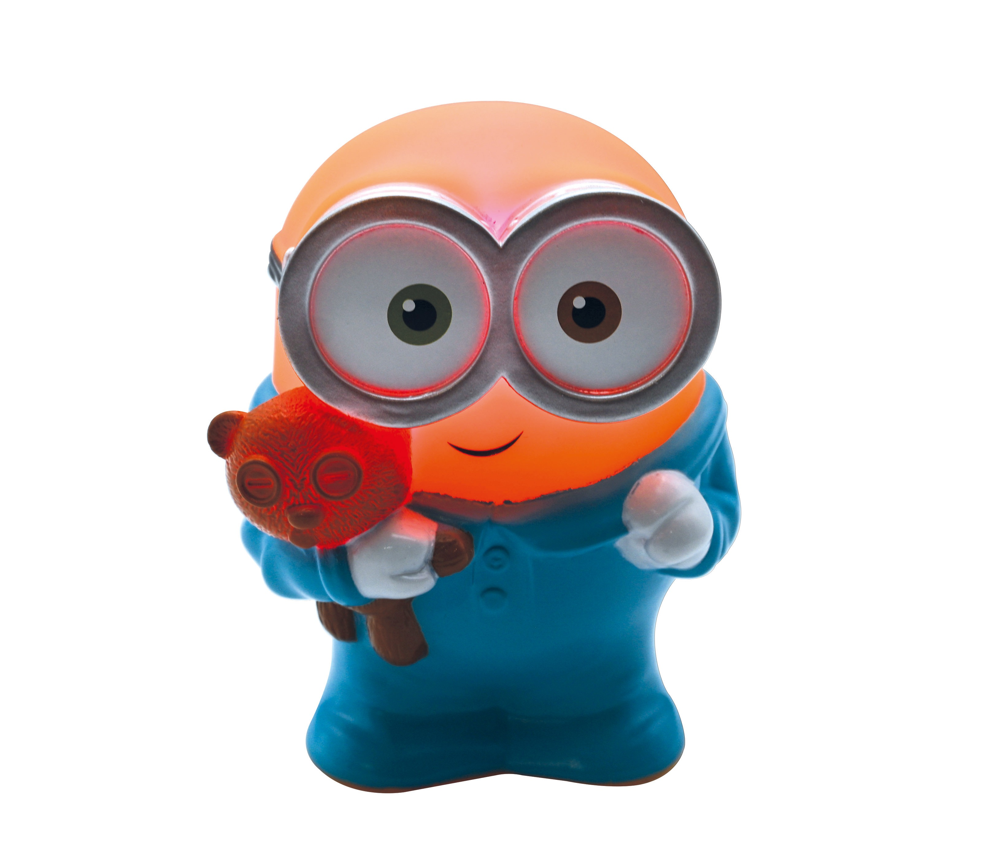 Ein Minion-Spielzeug hält einen Teddybär. Der Minion ist orange mit blauen Overalls und hat große Augen.