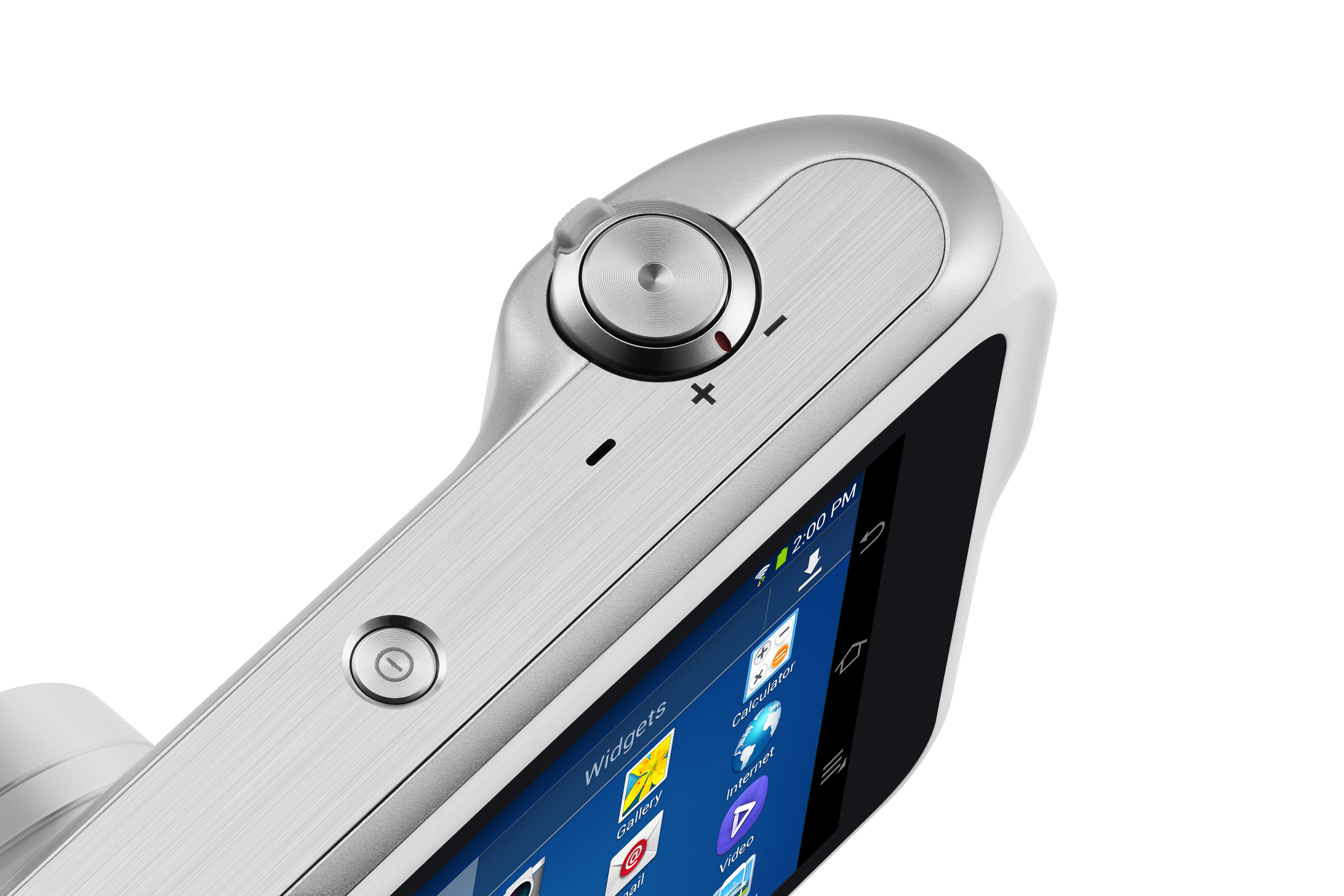 Close-up of a silver camera with a screen displaying apps. Silver dial and button on top.