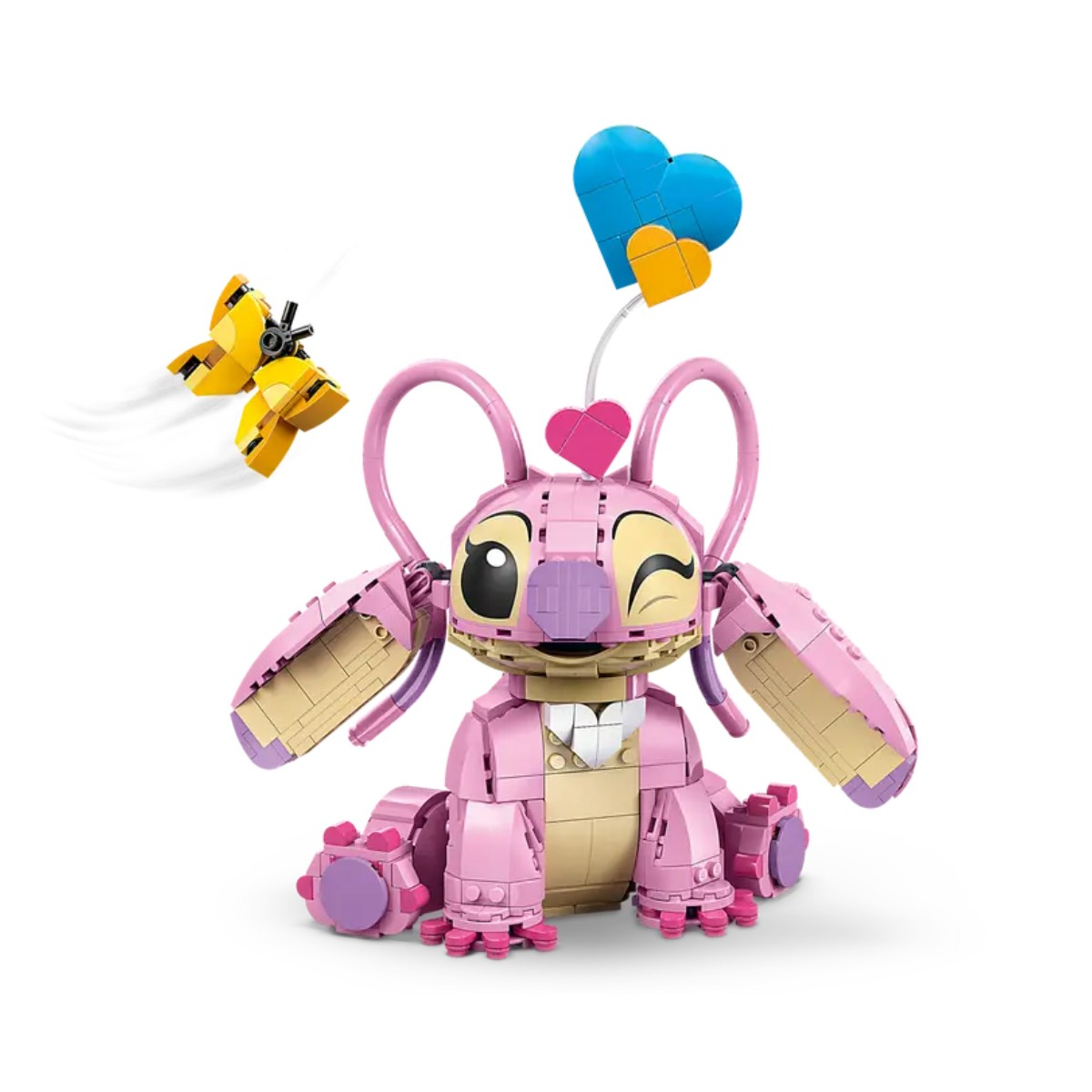 Różowa figurka Sticha mruga, z żółtym samolotem i niebiesko-pomarańczowymi balonami w tle.