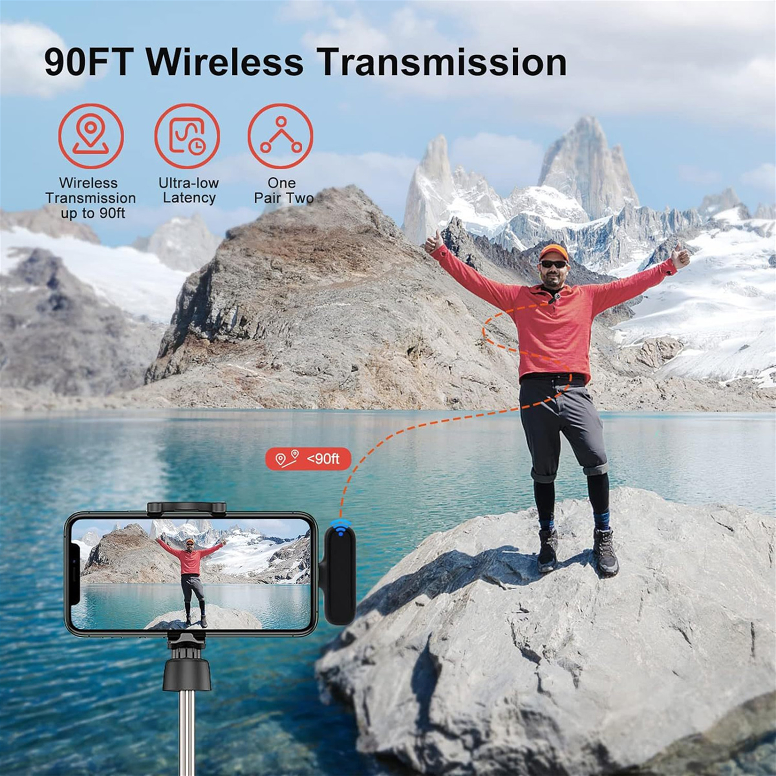 Ein Mann mit offenen Armen steht auf einem Felsen. Ein Telefon auf einem Stock zeigt sein Spiegelbild, mit Bergen dahinter.