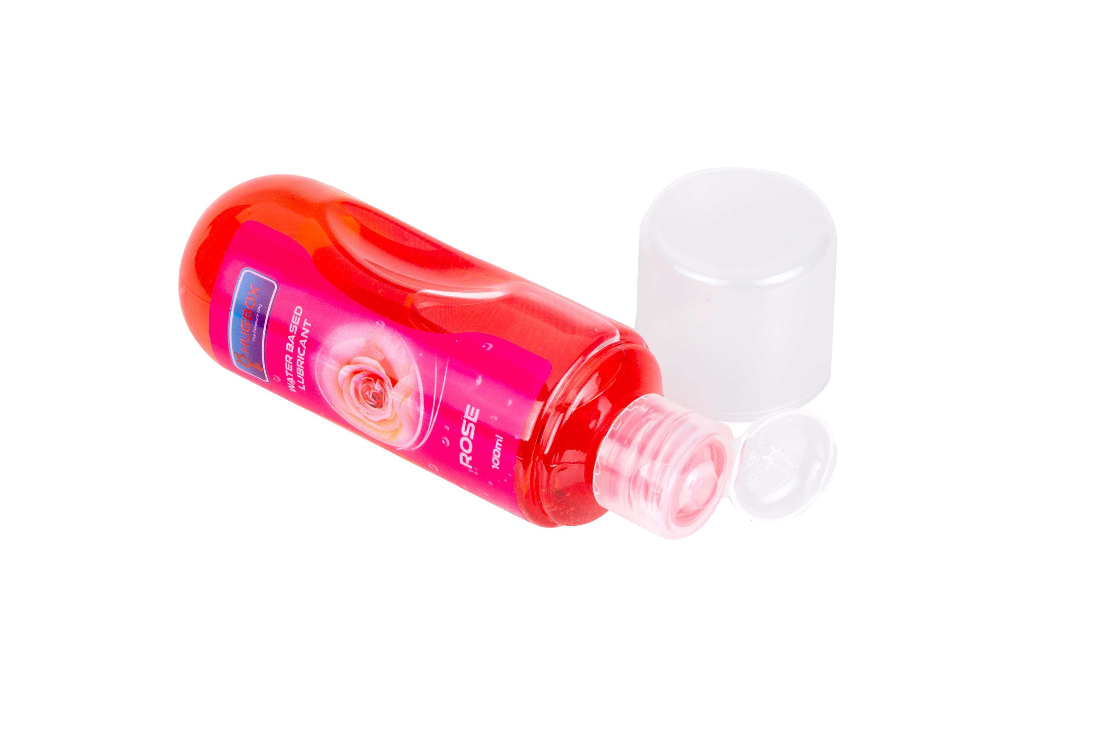 Una botella de lubricante roja, con una tapa blanca a un lado.